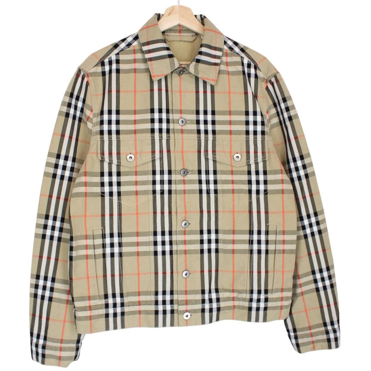 Burberry beige denim jacket featuring iconic Nova Check pattern and logo detail.