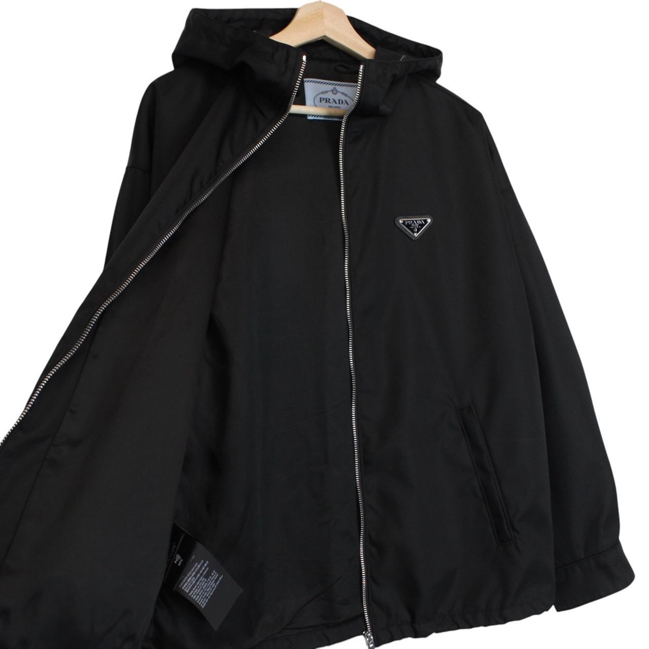 Prada black hooded jacket with full zip, Re-Nylon material, logo detail on sleeve.