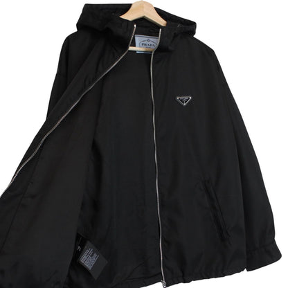Prada black hooded jacket with full zip, Re-Nylon material, logo detail on sleeve.