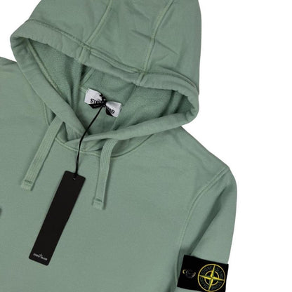 Stone Island green cotton hoodie with logo patch and drawstring hood.