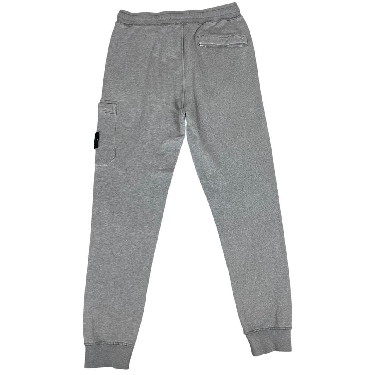 Stone Island grey joggers with logo patch and cotton material, size small.