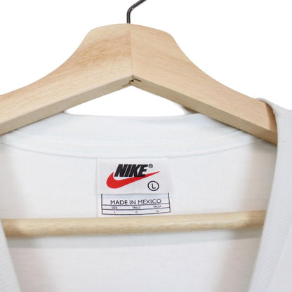 Nike white short sleeve cotton t-shirt with chest pocket and vintage logo.