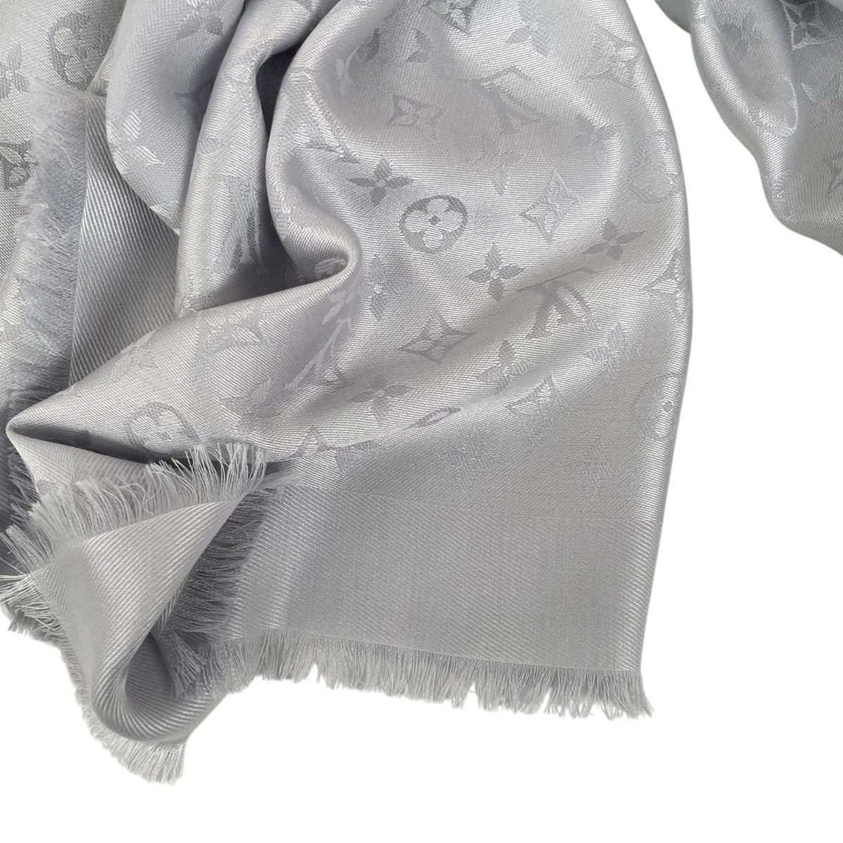 Louis Vuitton grey shawl scarf with LV monogram pattern in silk and wool blend.