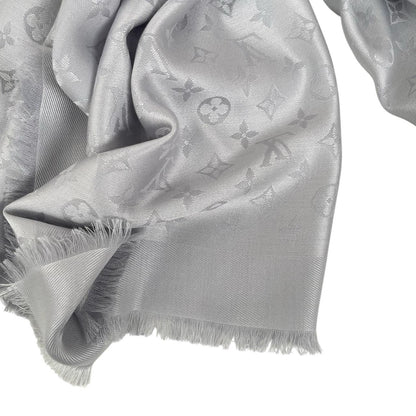 Louis Vuitton grey shawl scarf with LV monogram pattern in silk and wool blend.
