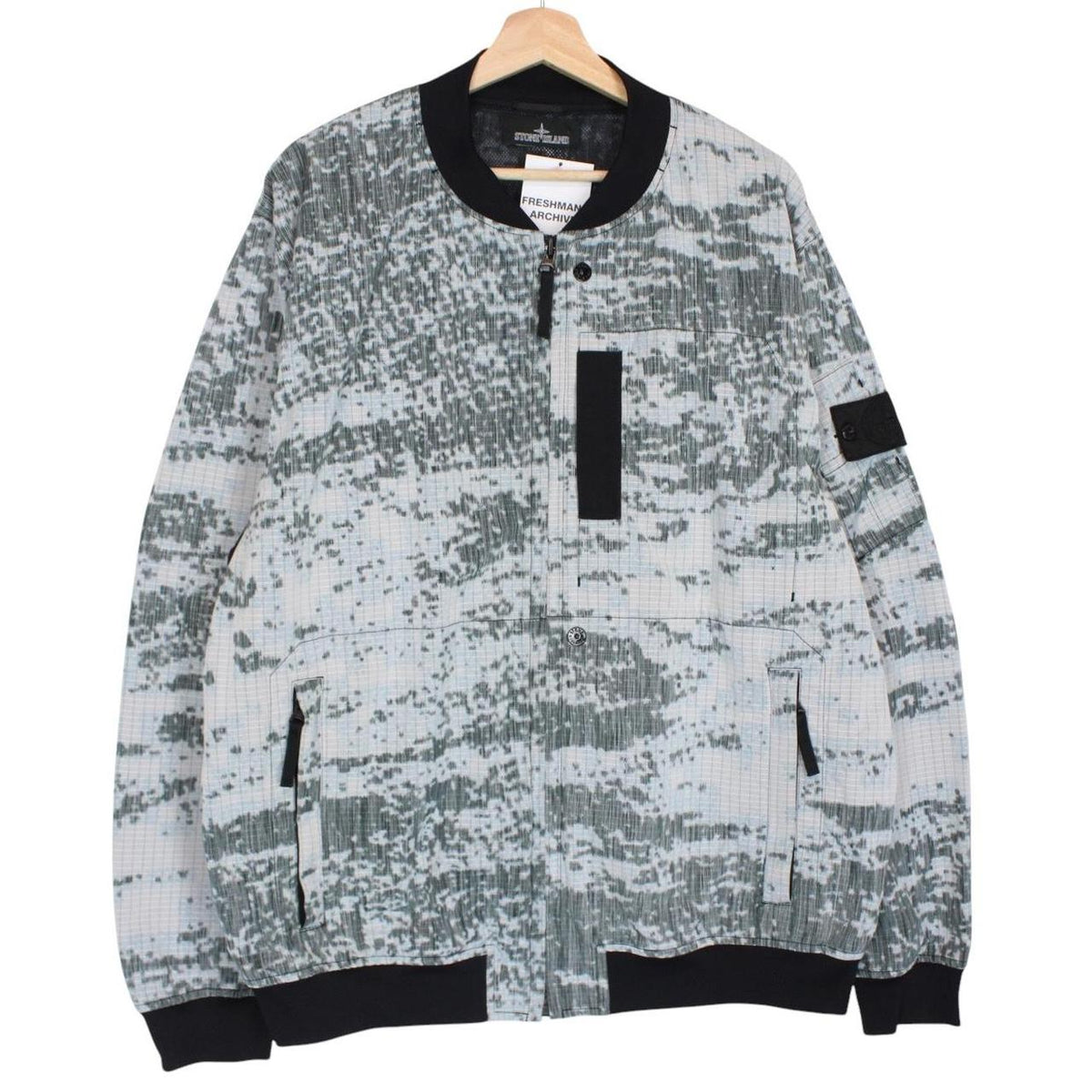 Stone Island bomber jacket grey marl with embroidered compass logo and unique pattern.