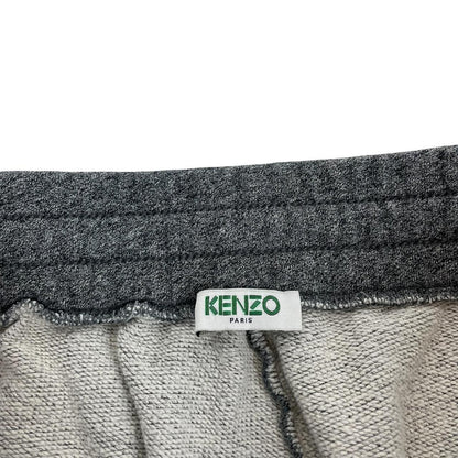 Kenzo grey joggers featuring embroidered tiger logo and soft cotton material.