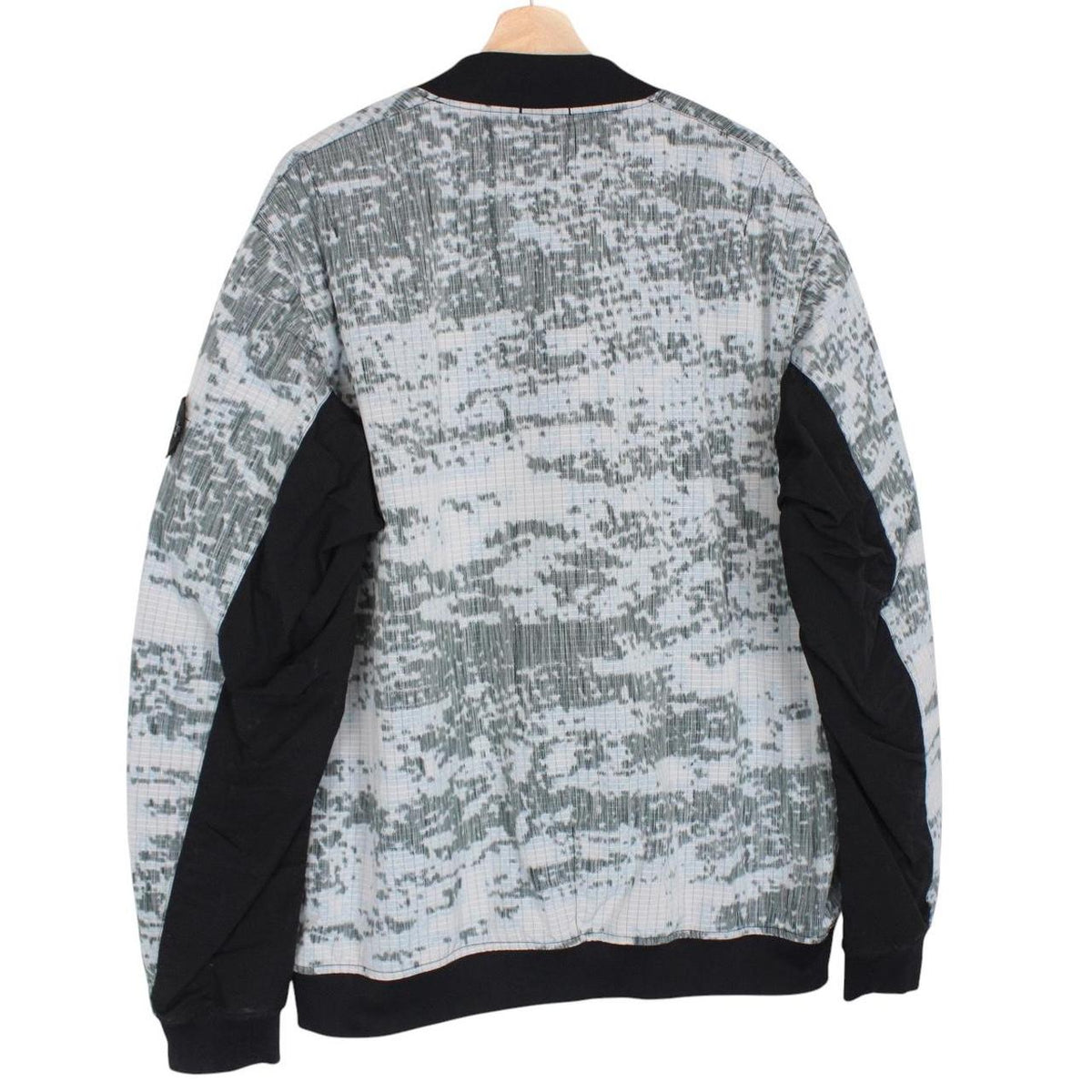 Stone Island bomber jacket grey marl with embroidered compass logo and unique pattern.