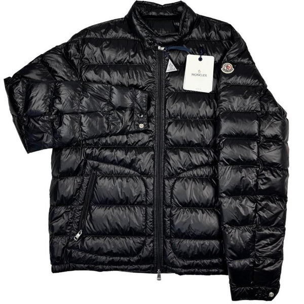 Moncler black nylon down jacket with full zip and logo patch on sleeve.