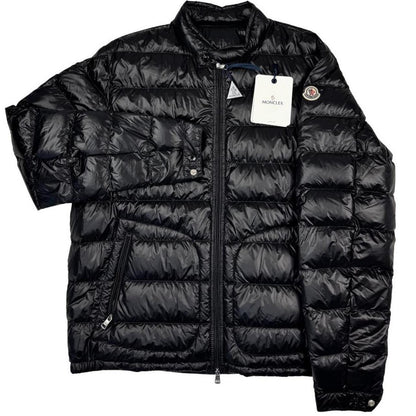 Moncler black nylon down jacket with full zip and logo patch on sleeve.