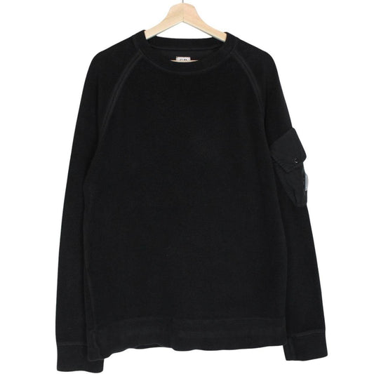 CP Company black fleece jumper with raglan sleeves and iconic lens detail.