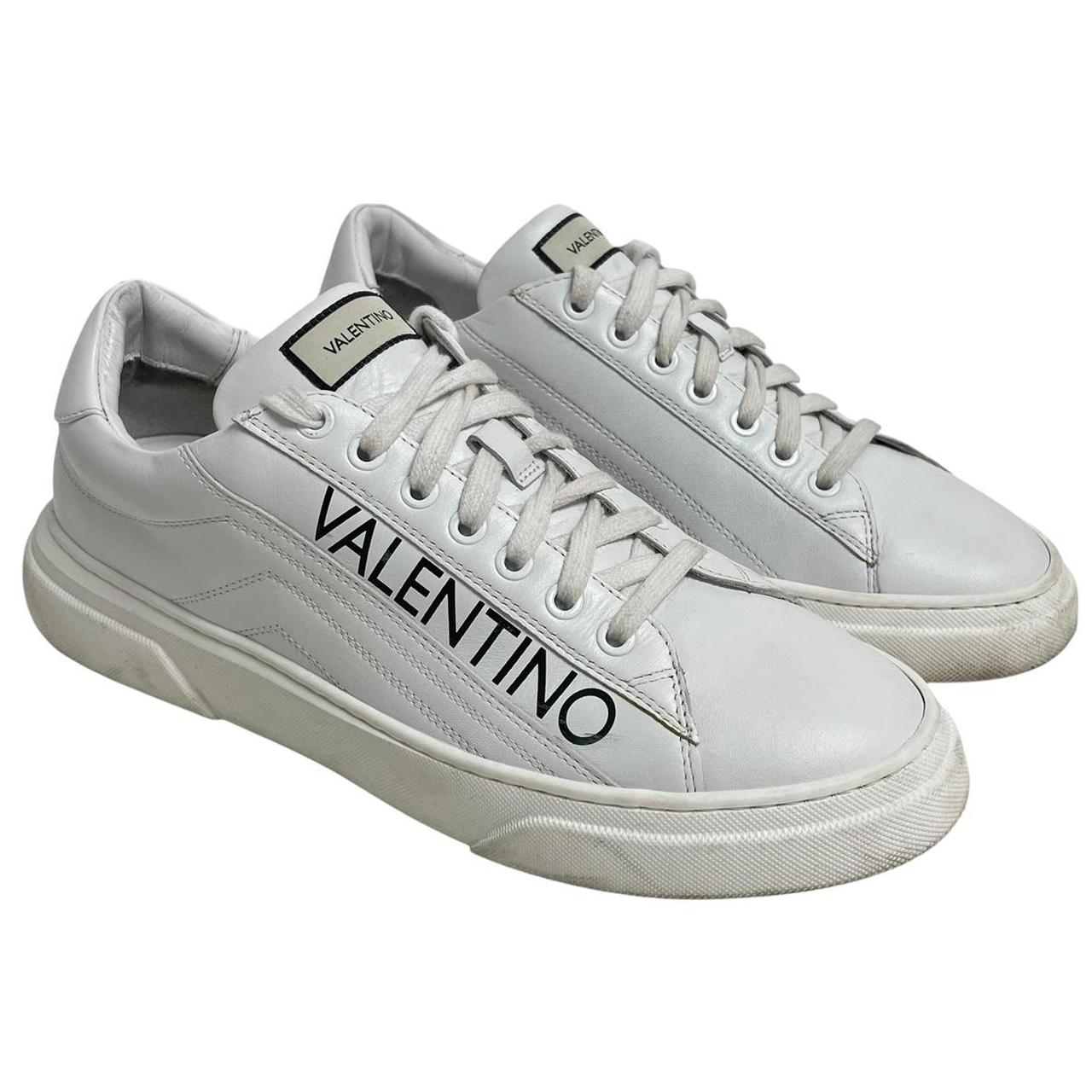 Valentino black and white trainers calfskin leather with logo detail and scuffed soles.