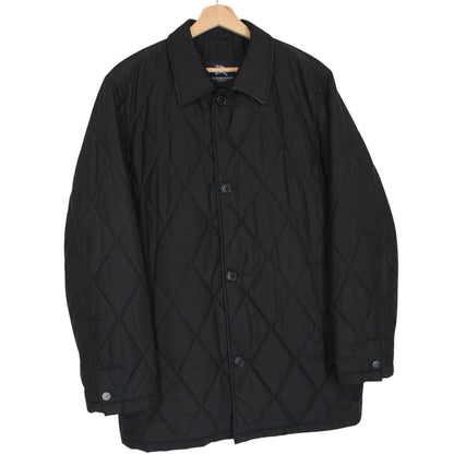 Burberry black coat with Nova Check lining and diamond quilted pattern.