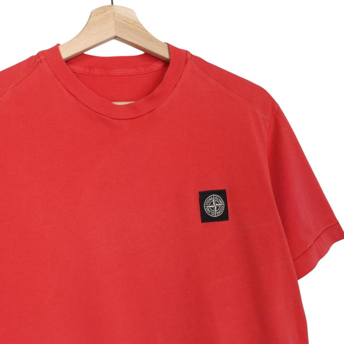 Stone Island red short sleeve cotton t-shirt with compass logo on chest.