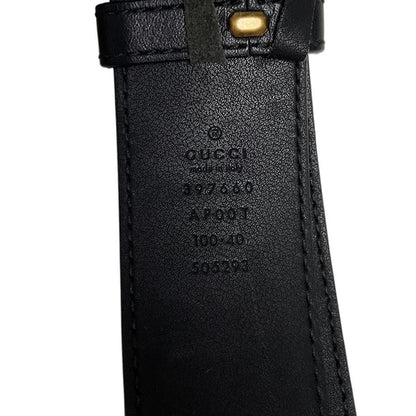 Gucci black leather Marmont belt with antique gold double G logo buckle.