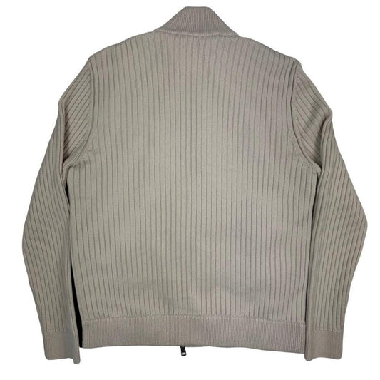 Moncler beige full zip jacket with logo detail and nylon/wool blend material.