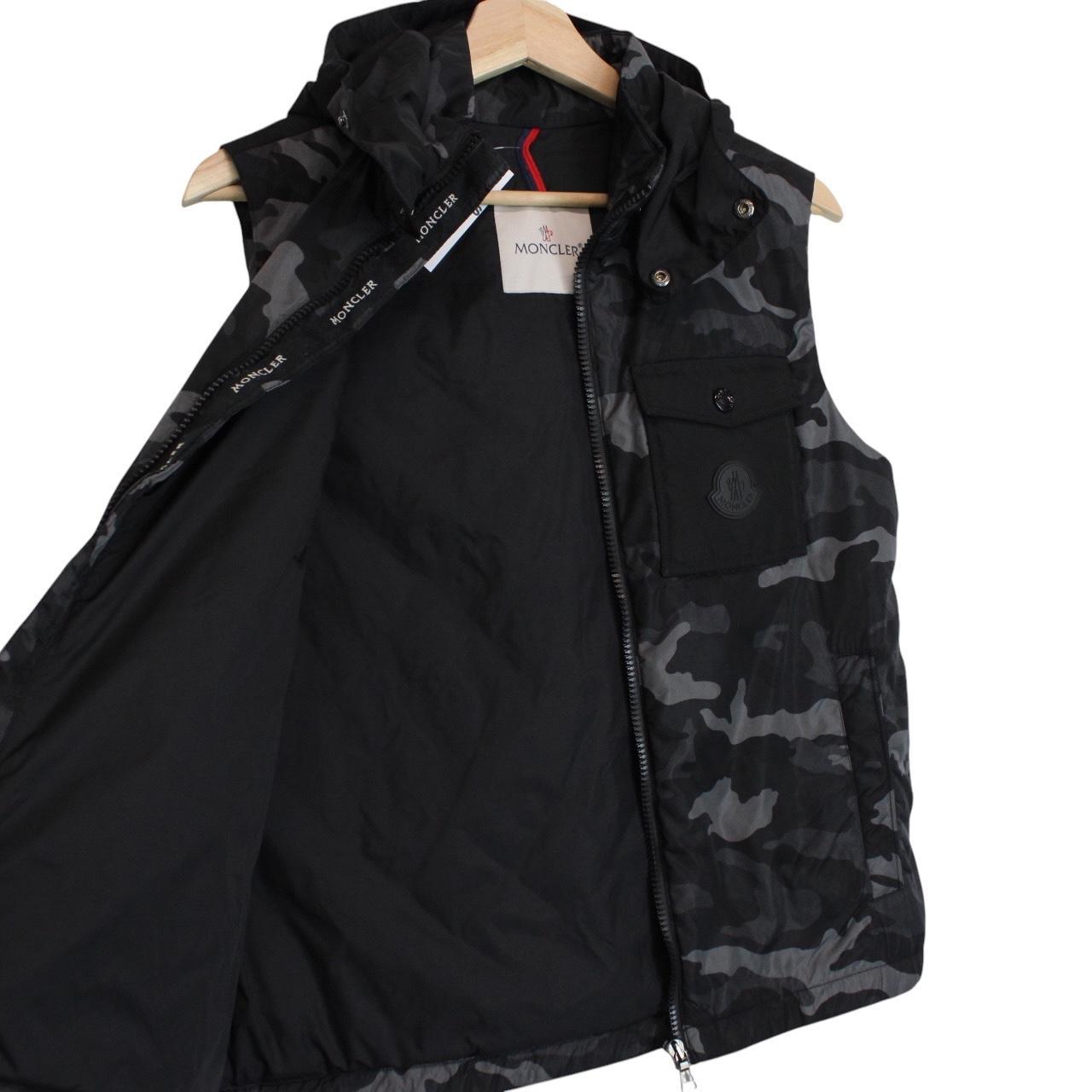 Moncler black and grey full zip down hooded gilet with logo and quilted design.