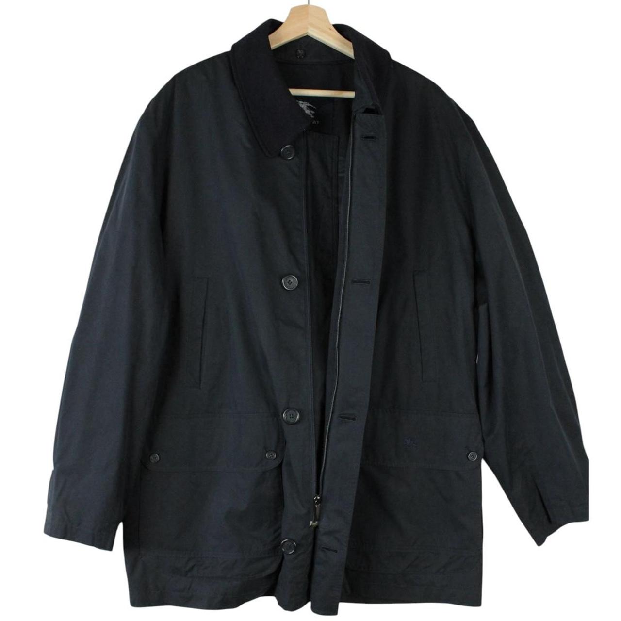 Burberry navy blue wool coat with Nova Check lining and logo detail.