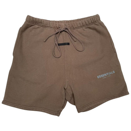 Essentials brown jogger shorts with logo detail and soft cotton material.