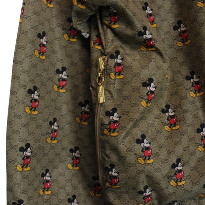 Gucci x Disney khaki brown windbreaker jacket with monogram pattern and nylon material.