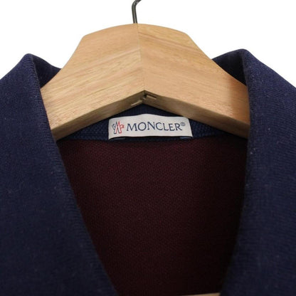 Moncler burgundy short sleeve polo shirt with logo detail and cotton material.