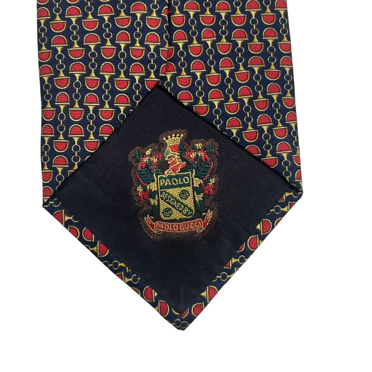 Gucci silk tie red and navy blue horsebit pattern with logo detail.