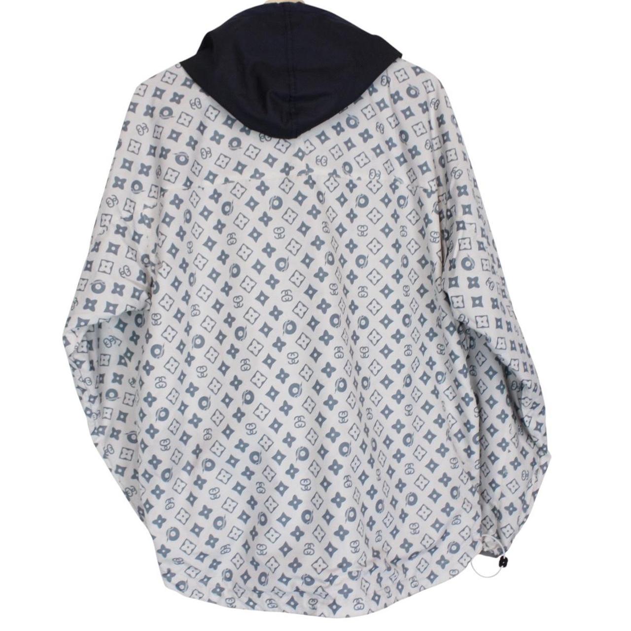 Stüssy reversible nylon jacket in grey and navy blue with logo detailing.