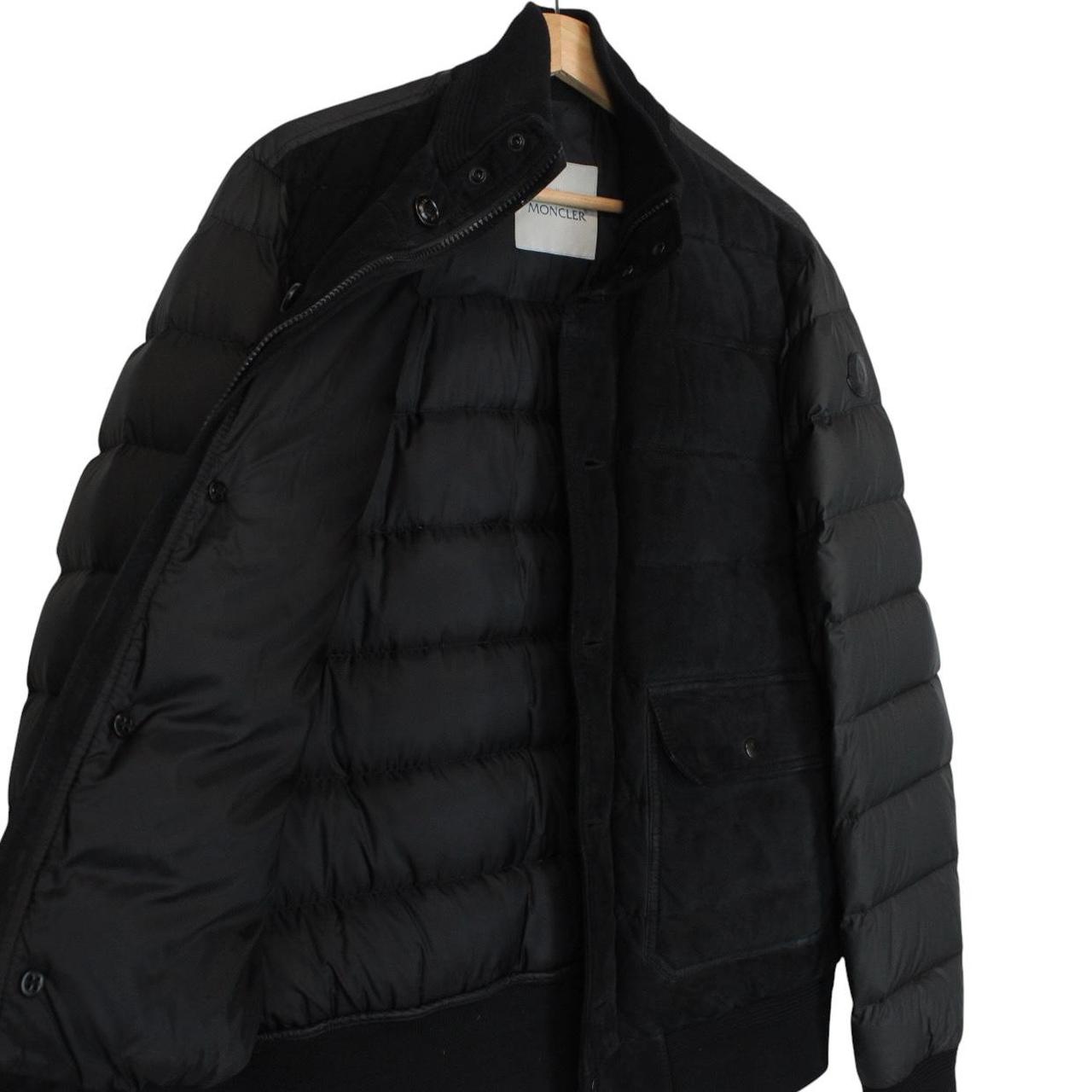 Moncler black suede leather down jacket with full zip and missing badge detail.