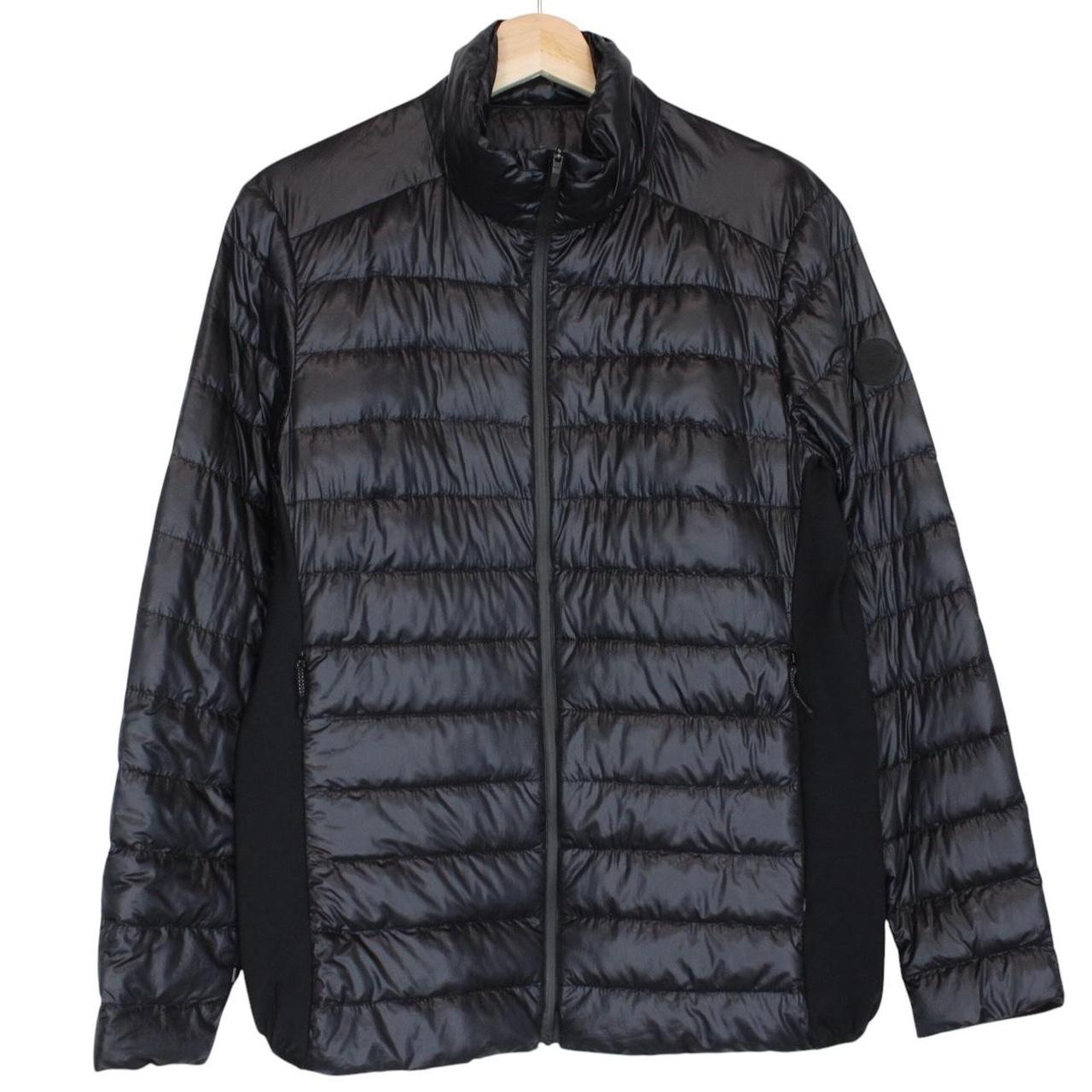 Moncler black lightweight down jacket with full zip and logo patch on sleeve.