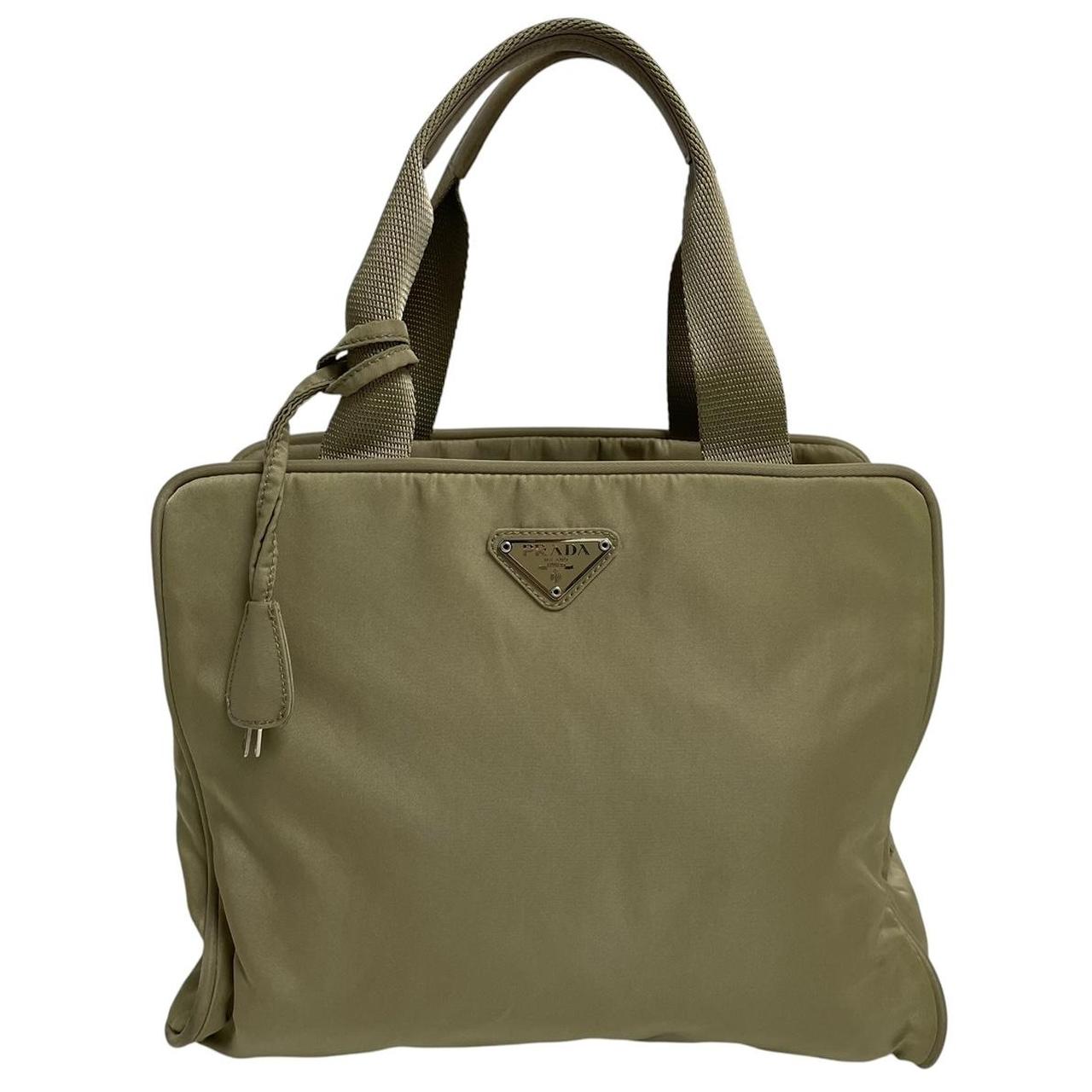 Prada green nylon duffel bag with logo detail and working lock and key.