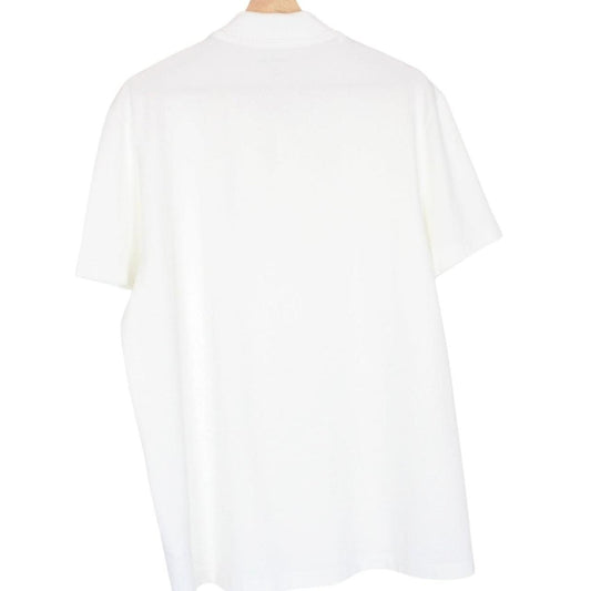 Lacoste white short sleeve polo shirt with green crocodile logo and cotton material.