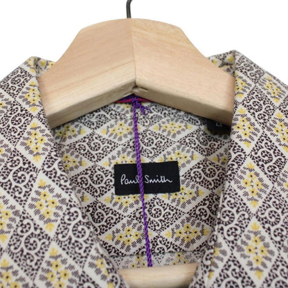Paul Smith cream formal shirt with multicoloured abstract pattern and long sleeves.