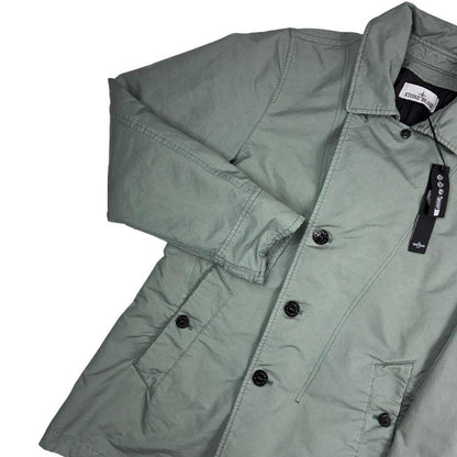Stone Island green jacket with Primaloft insulation and iconic compass logo.