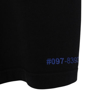 Moncler black and white short sleeve t-shirt with vertical logo design.
