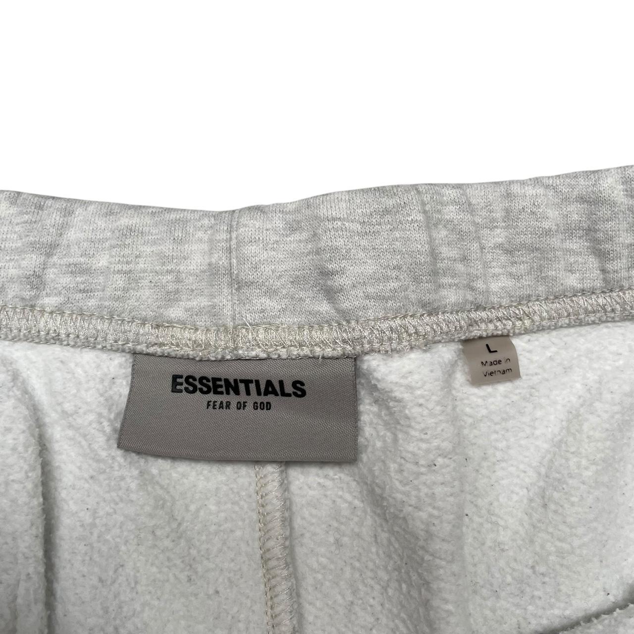 Essentials grey jogger shorts cotton material with logo detail and relaxed fit.