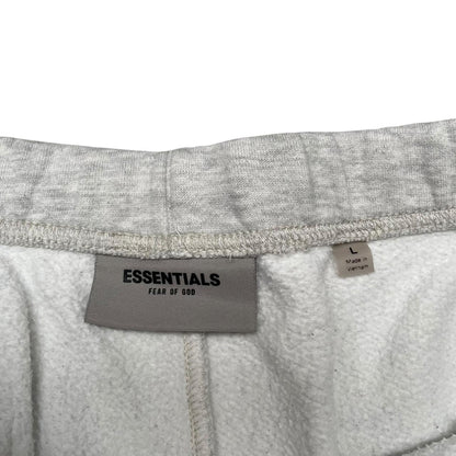 Essentials grey jogger shorts cotton material with logo detail and relaxed fit.