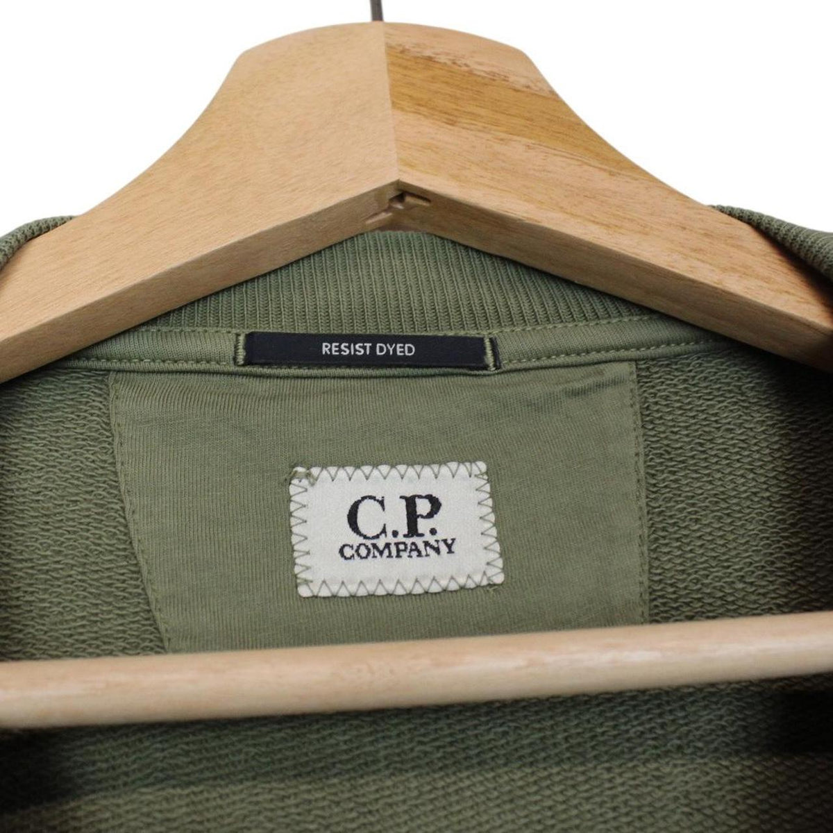 CP Company green sweatshirt diagonal fleece with signature lens detail and logo.