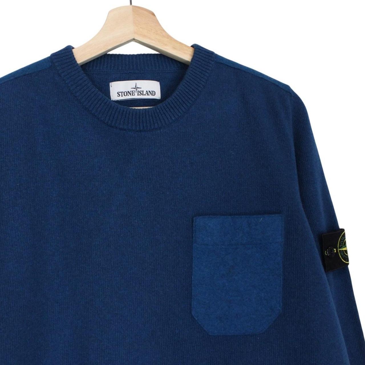 Stone Island blue wool knit jumper with logo patch and ribbed cuffs.