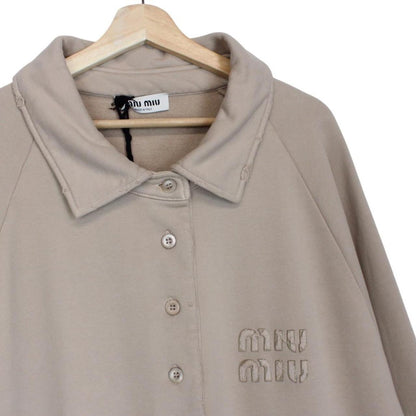 Miu Miu beige cotton polo sweatshirt with embroidered logo, oversized fit, brand new with tags.