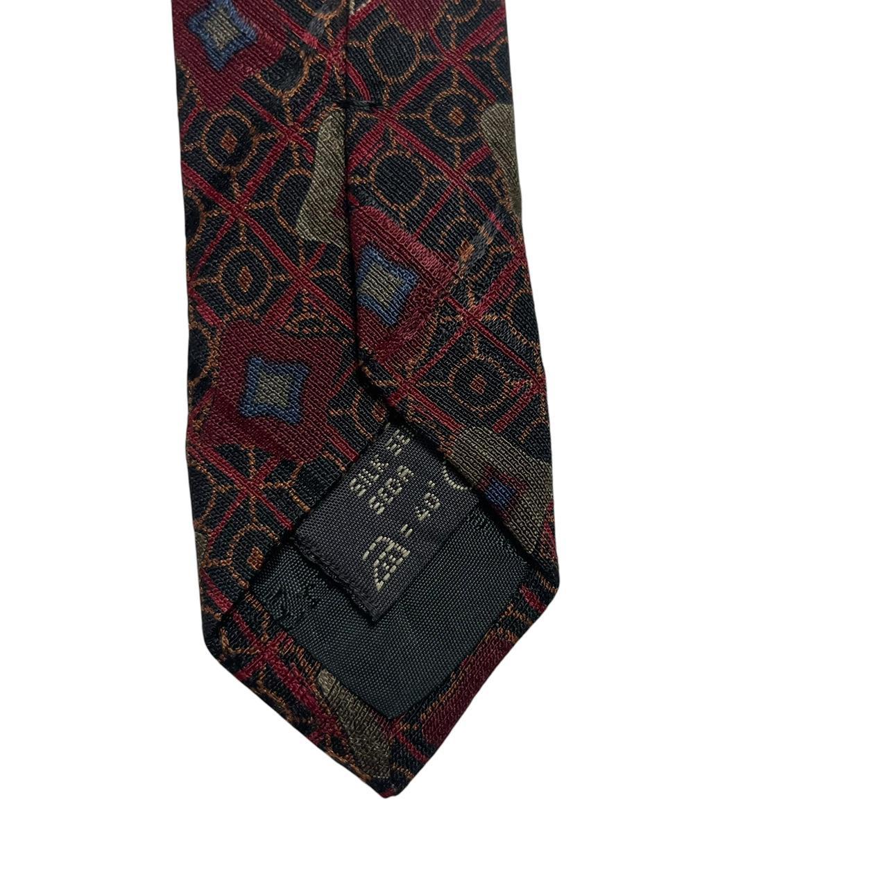 Ermenegildo Zegna burgundy silk tie with abstract print design and logo detail.