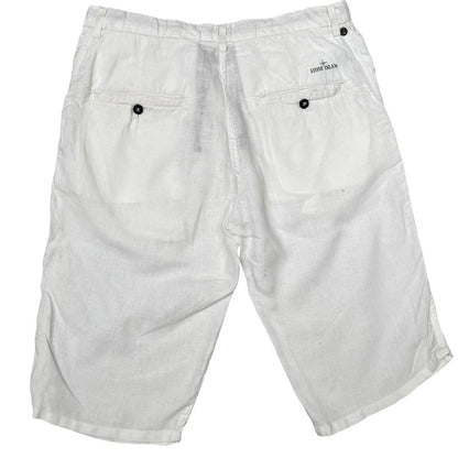 Stone Island white linen Bermuda shorts with logo patch and subtle stains.