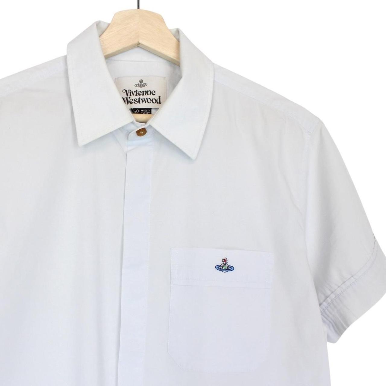 Vivienne Westwood light blue short sleeve cotton shirt with orb logo and collar discoloration.