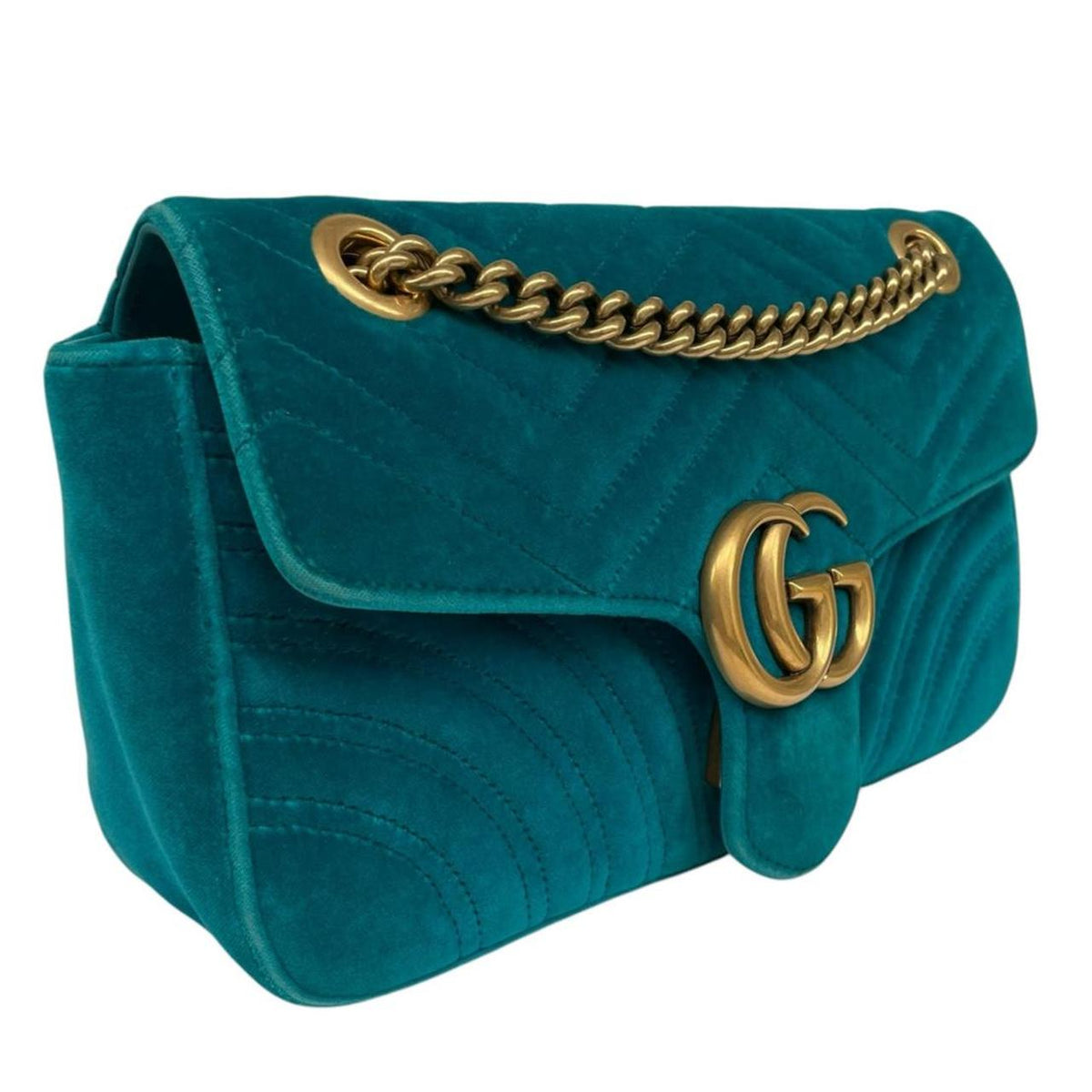 Gucci turquoise velvet shoulder bag with gold GG logo and green accents.