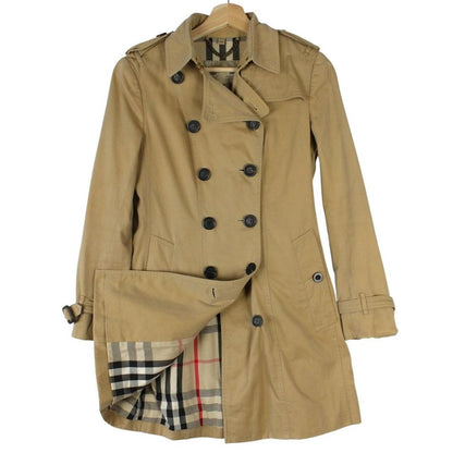 Burberry tan brown trench coat with Nova Check pattern and double-breasted design.
