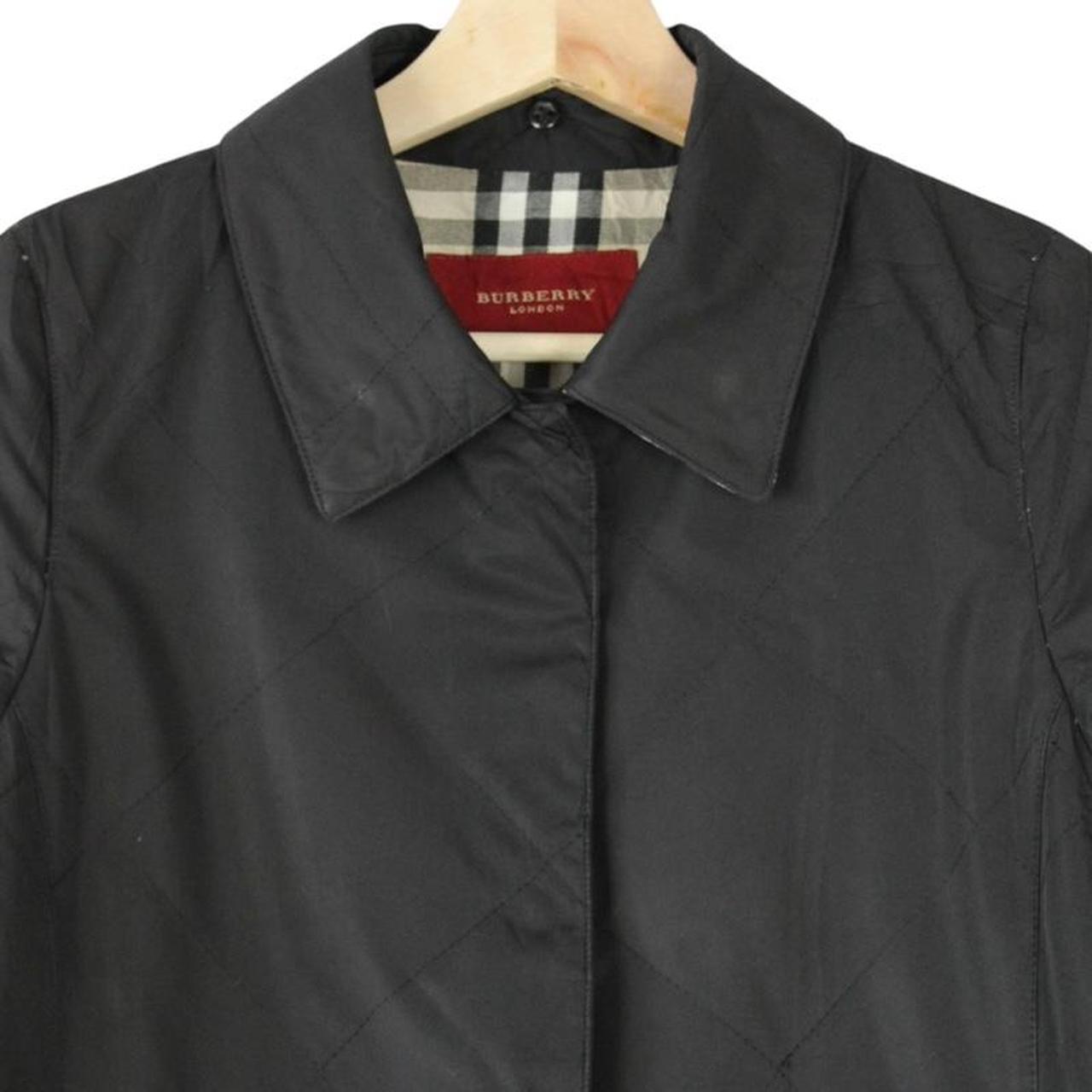 Burberry black trench coat featuring Nova Check pattern and quilted fabric.