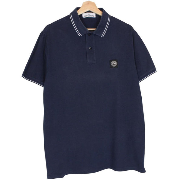 Stone Island navy blue polo shirt with embroidered compass logo and cotton material.