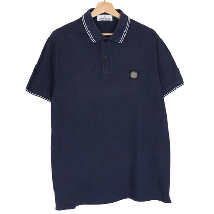 Stone Island navy blue polo shirt with embroidered compass logo and cotton material.