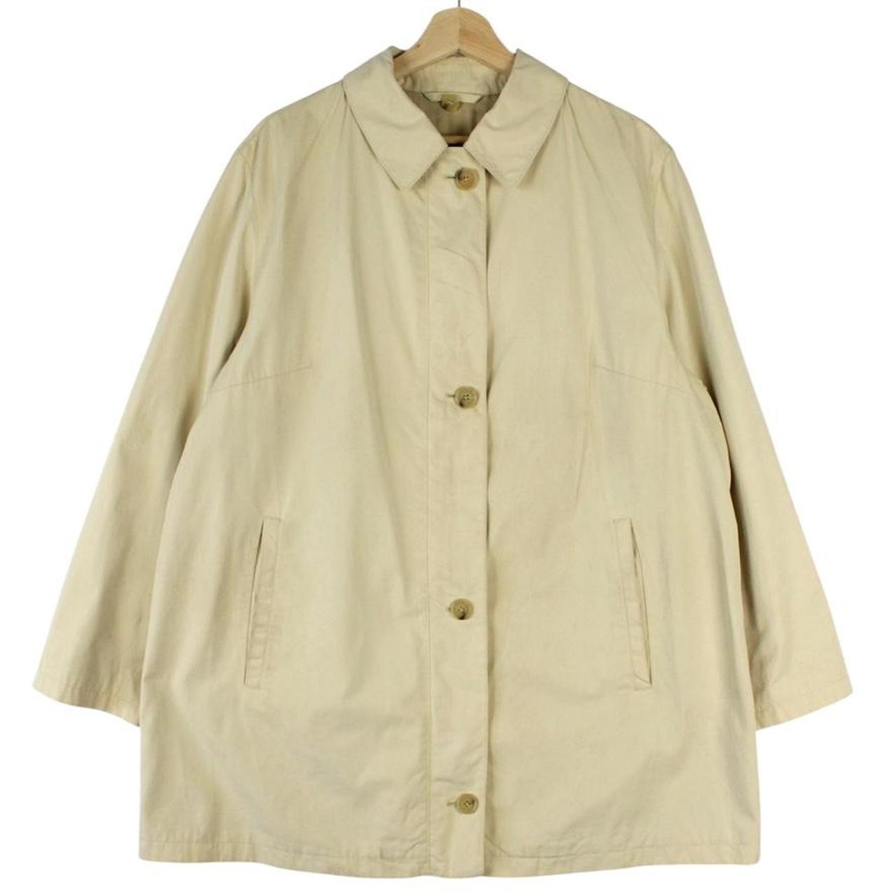 Burberry beige single breasted coat with logo detail and classic tailored design.