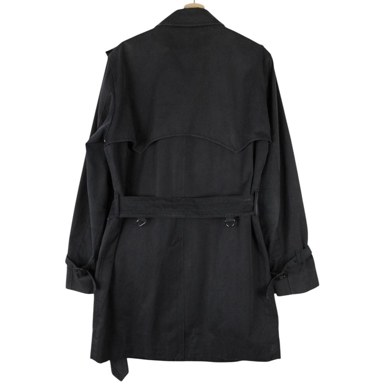 Aquascutum black trench coat with house check pattern and belted waist detail.