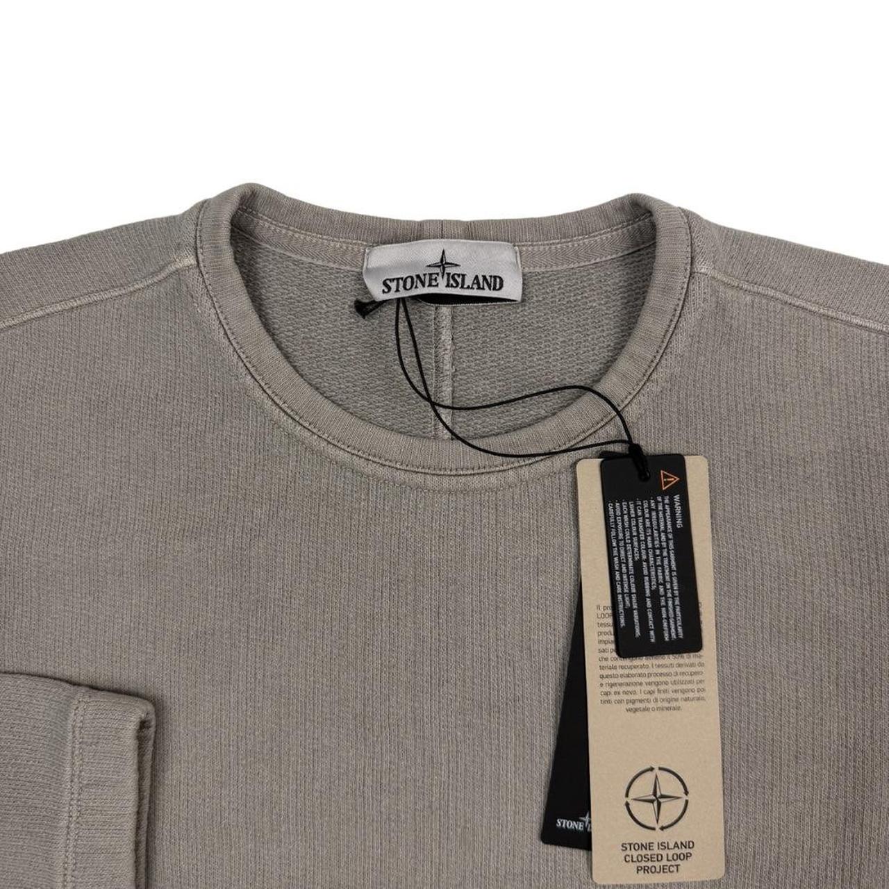 Stone Island khaki brown sweatshirt with logo patch and closed loop design.