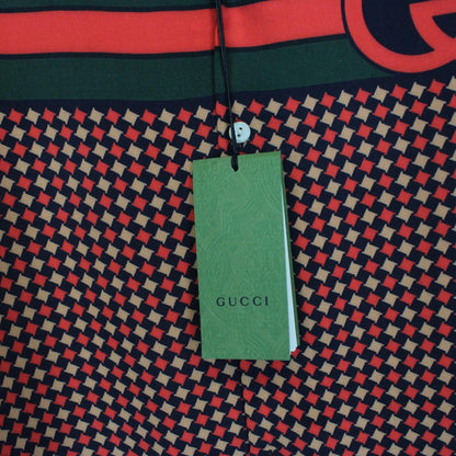 Gucci silk short sleeve bowling shirt in red and navy blue houndstooth pattern.